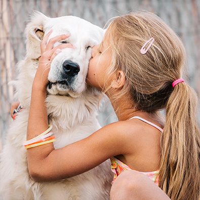 girl kissing white golden